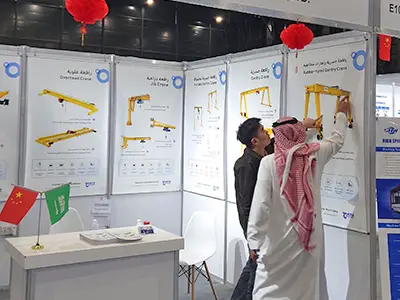 Yuantai Cranes booth attracting international buyers interested in European-style hoists, RTG cranes, and overhead crane technology.